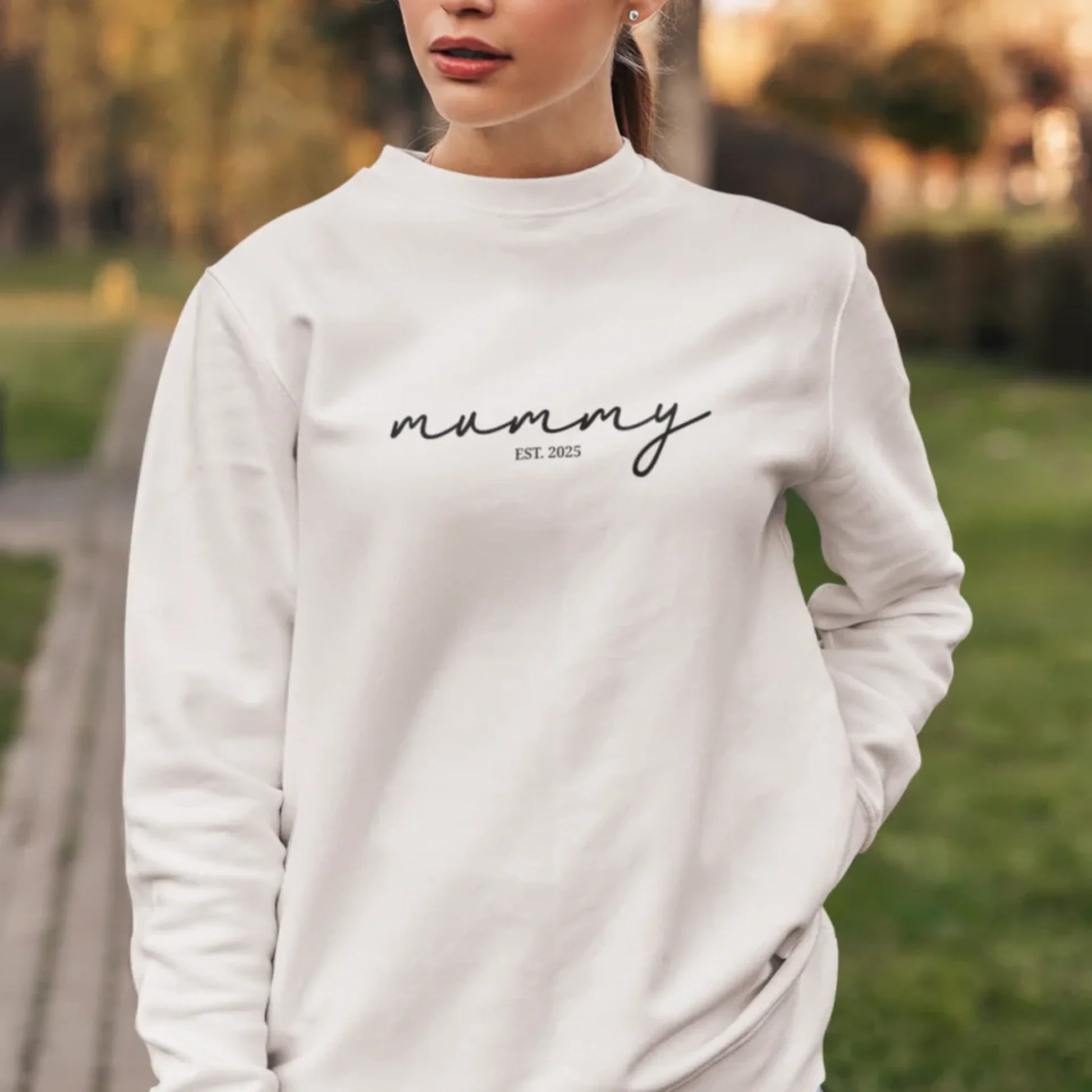 crewneck-sweatshirt-of-a-serious-woman-posing-in-a-garden-5294-el1